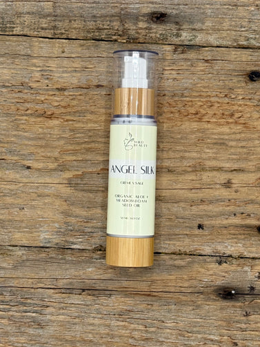 Skincare bottle labeled 'Angel Silk' on a wooden surface