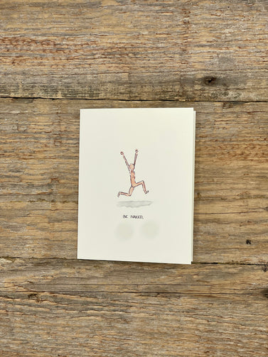 Note card with a drawing of a person running on a wooden surface