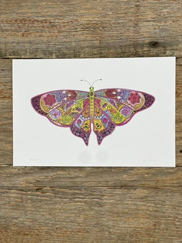Colorful butterfly illustration on a white card with a wooden background