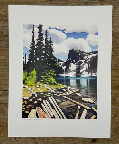 Painting of a mountain landscape with a lake and dock on a wooden surface