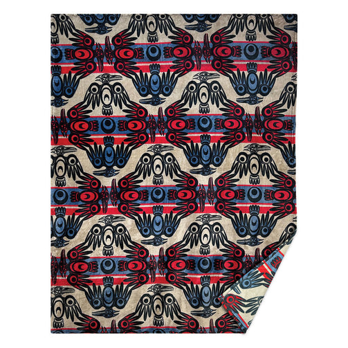 Fleece blanket with indigenous designs on it