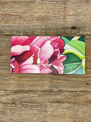 Colorful floral painting on card on a wooden surface