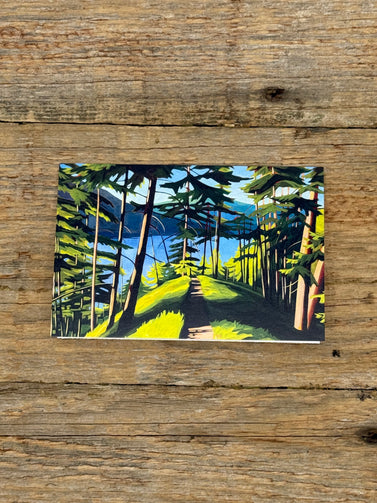Painting of a forest path on a wooden surface