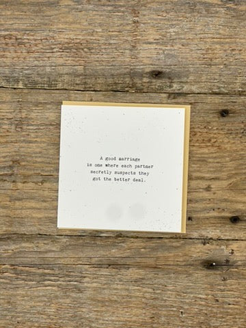 Card with text on a wooden surface