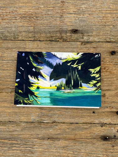 Painting of a forest scene on a wooden surface