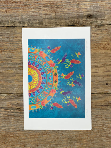 Colorful mandala design on a wooden surface