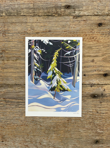 Winter forest scene on a wooden surface