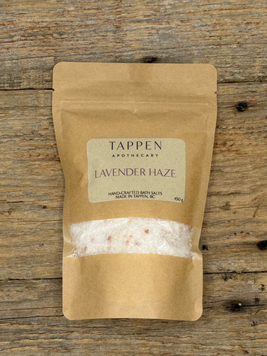 Kraft paper packaging of Tappen Apothecary Lavender Haze bath salts on a wooden surface