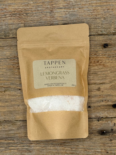 Kraft paper packaging of Tappen Apothecary Lemongrass Verbena bath salts on a wooden surface