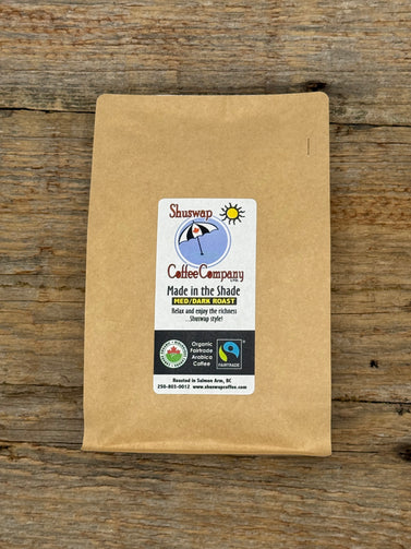 Kraft paper coffee bag with a label on a wooden surface