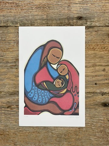 Colorful illustration of a mother and child on a white card, placed on a wooden surface.
