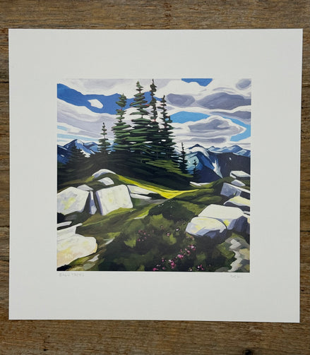 Painting of a mountain landscape with trees and rocks on a wooden surface