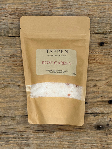 Kraft paper packaging of Tappen Apothecary Rose Garden bath salts on a wooden surface
