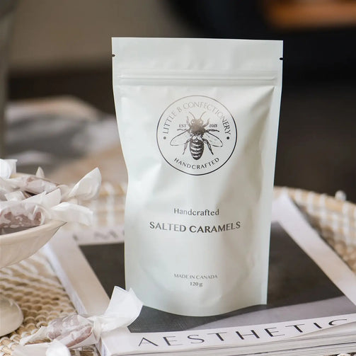 White packaging of Little Beechwoodery salted caramels on a magazine with blurred background
