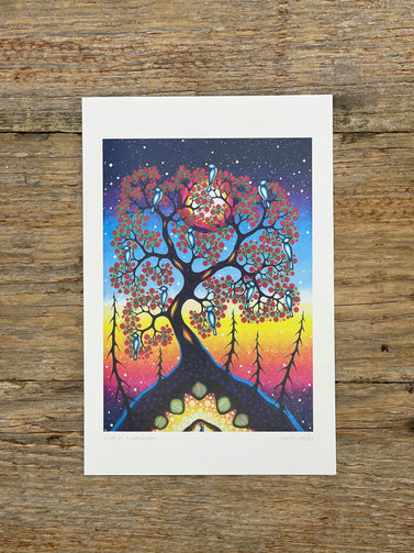 Colourful tree of knowledge illustration with birds on a wooden surface