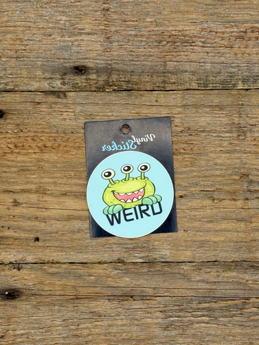 Vinyl sticker with a cartoon character on a wooden surface