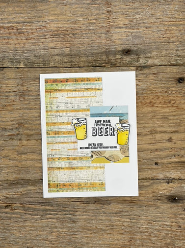Printed sheet with beer-themed design on a wooden surface