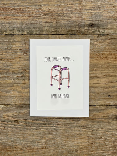 Greeting card with a walker illustration and text on a wooden surface
