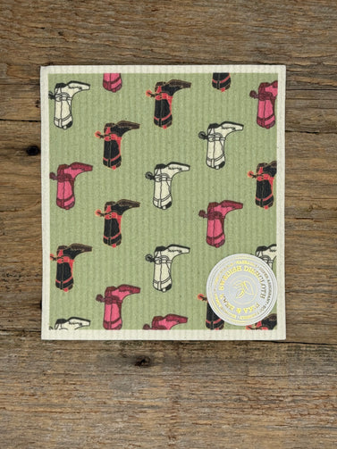 Patterned cloth with cartoon-like designs on a wooden surface