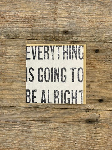 Motivational card with 'Everything is going to be alright' text on a wooden background