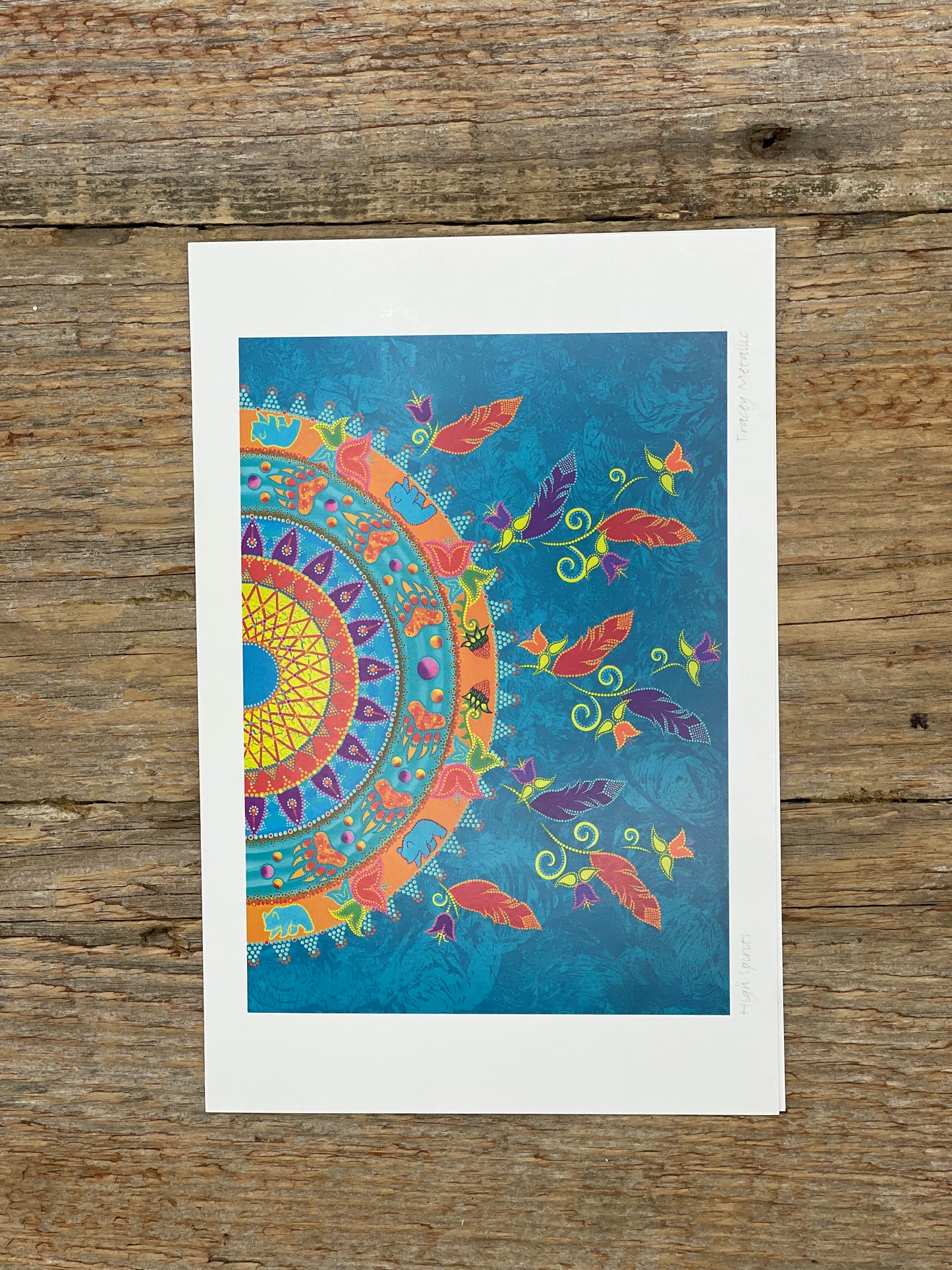 Colorful mandala design on a wooden surface