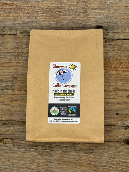 Kraft paper coffee bag with a label on a wooden surface