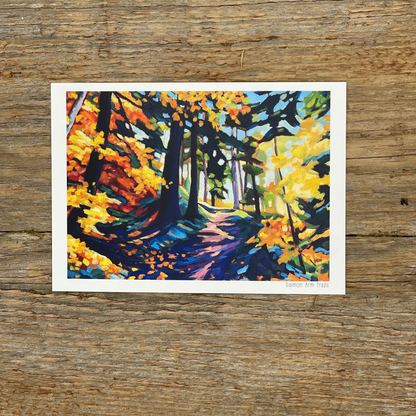 Colorful forest painting on a wooden surface