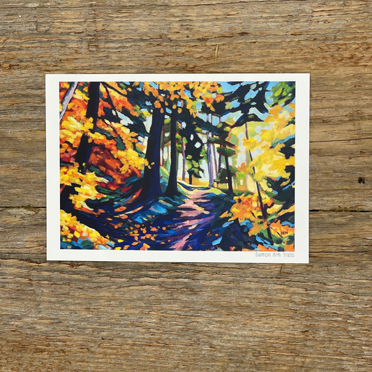 Colorful forest painting on a wooden surface