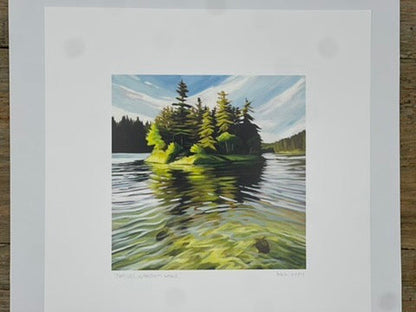 Matted artwork of a forest scene with trees reflected in water.