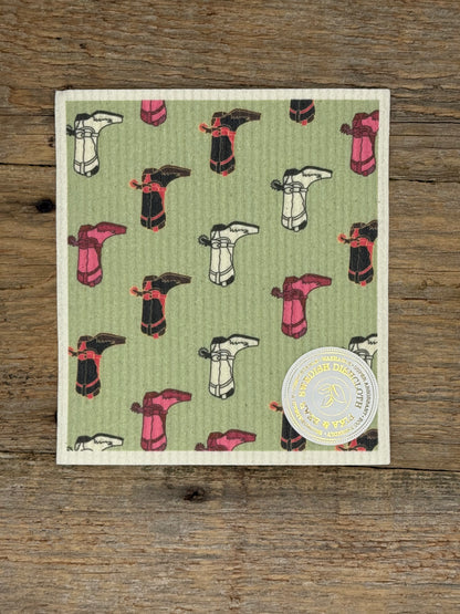 Patterned cloth with cartoon-like designs on a wooden surface