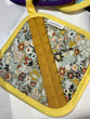 yellow pot holder with floral designs